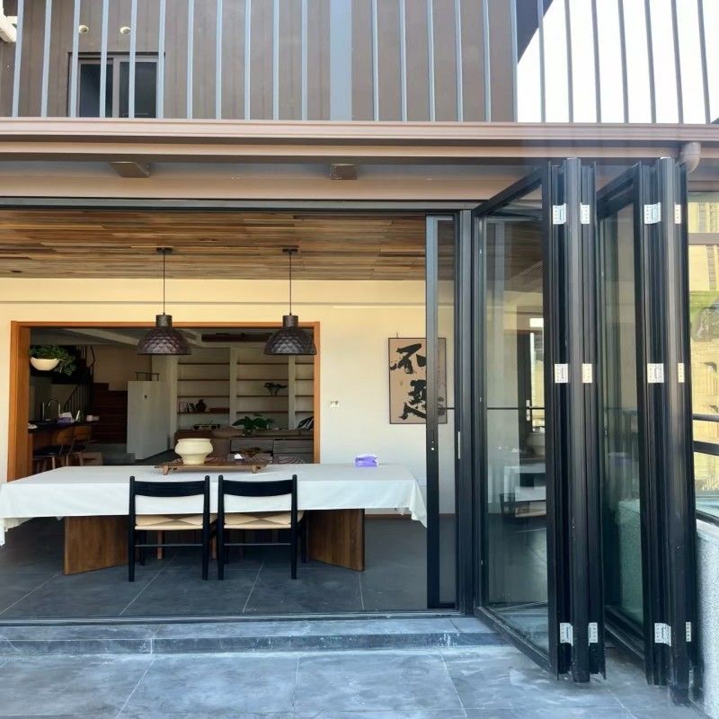 Porta a vetri pieghevole in alluminio con taglio termico ad alte prestazioni con doppi vetri per spazi esterni